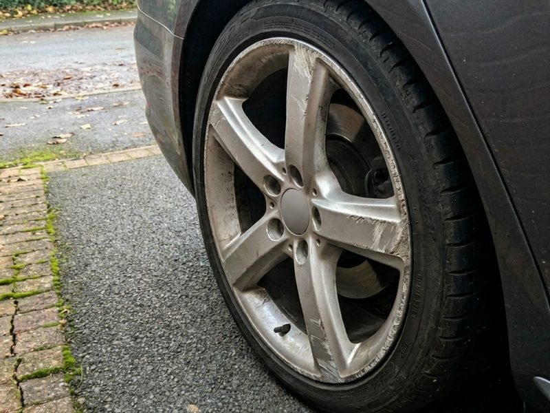 Kerbed alloy wheel before repair